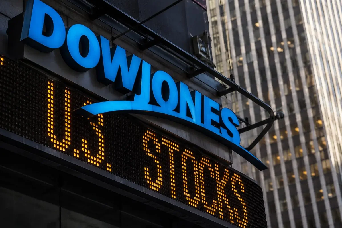 Dow Plunges Over 1,100 Points on Fed Stance, Caterpillar and Goldman Sachs Lead Decline
