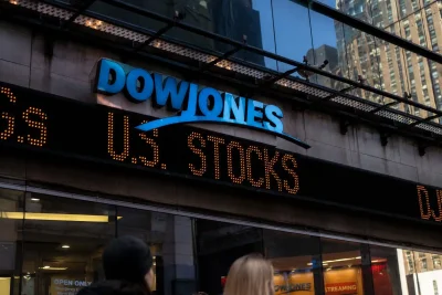 Dow Hits Record as Oil Slumps; AI Chip Concerns Curb Nasdaq