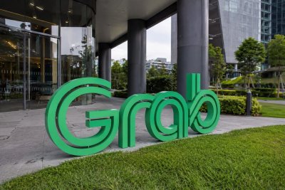 Grab Rises on $400M Buyback Plan Despite Insider Sale