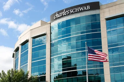 Schwab Stock Gains on Record May Metrics Amid AI and Crypto Headwinds